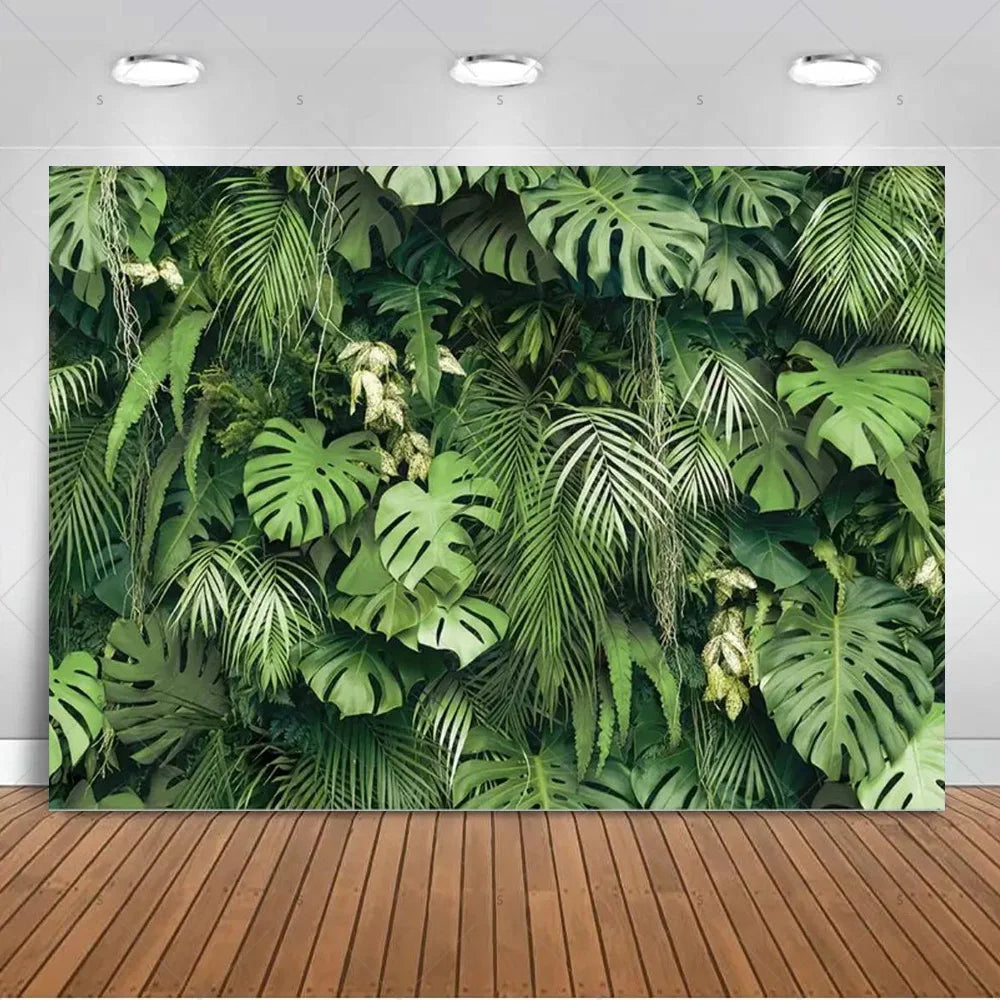 A lush green tropical palm leaf backdrop used for party decor and photography