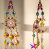 A golden crystal suncatcher wind chime ornament featuring purple and blue faceted crystals and a crescent moon shape.