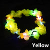 A glowing yellow LED flower crown headband with multiple colored lights against a black background.