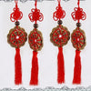 Four red tassels with intricate knot designs for Feng Shui mystic wall decor