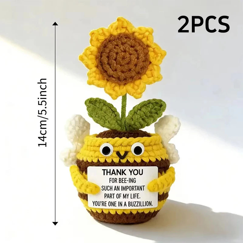 Two hand crocheted sunflower bee potted ornaments with a thank you message
