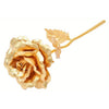 A metallic gold foil rose flower with a thin gold stem and leaf, part of a gift set.