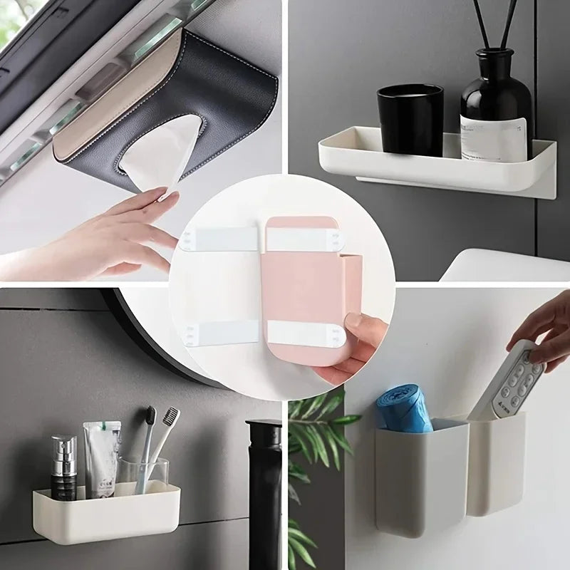 A hand is placing pink reusable double-sided adhesive picture hanging strips into a white storage container.