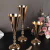 A set of elegant golden silver wedding flower vases with tapered glass bowls and ornate bases.