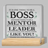 A clear acrylic plaque with text appreciating a boss, mentor, and leader.