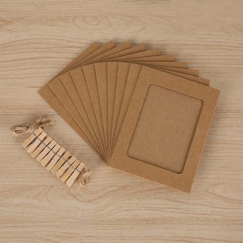 A stack of rustic wooden clip photo display sets with kraft paper frames arranged on a light wood surface.