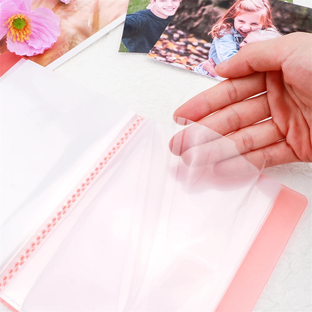 Clear A6 storage album with 40 pages for stickers, photos, and craft supplies shown open on a white surface.