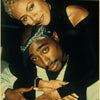 A portrait of Tupac Shakur and his girlfriend, taken in a close-up shot.