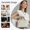A woman holds a beige paperclip chain bag, demonstrating its versatile usage as a handbag replacement.