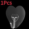 A single transparent self-adhesive hook shaped like the letter J is shown against a black background.