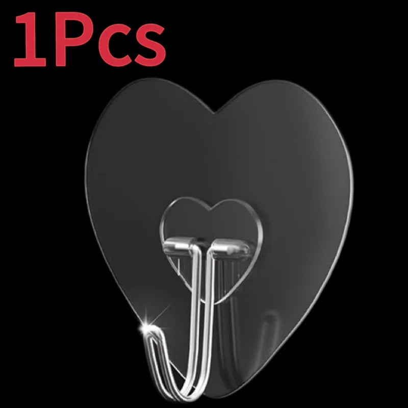 A single transparent self-adhesive hook shaped like the letter J is shown against a black background.