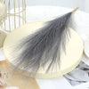 A bundle of gray artificial pampas grass used as boho home decor