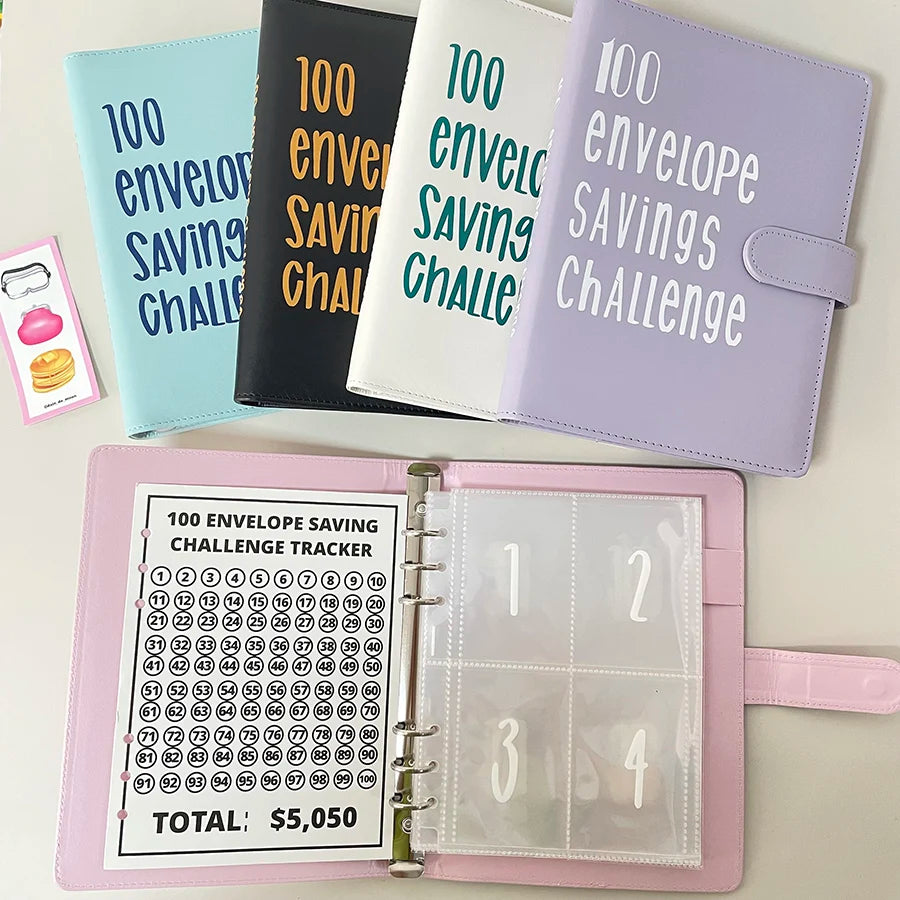 A set of colorful 100 envelope savings challenge binders and a pink tracker with numbered pockets.