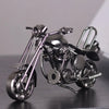 A handcrafted metal motorcycle model featuring vintage diecast details and chrome finish.