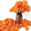 A bouquet of bright orange silk marigold flowers displayed in a textured vase.