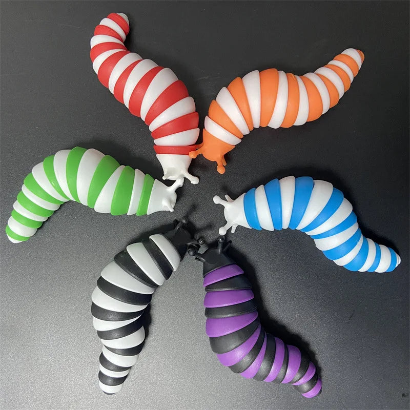 Five colorful, segmented fidget slug toys in red, orange, green, white, and purple are displayed against a dark background.