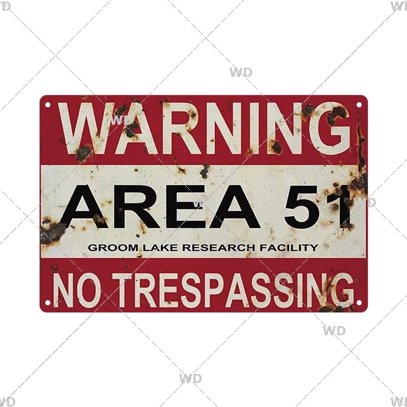 Vintage red and white warning sign plaque with the text WARNING AREA 51 and NO TRESPASSING
