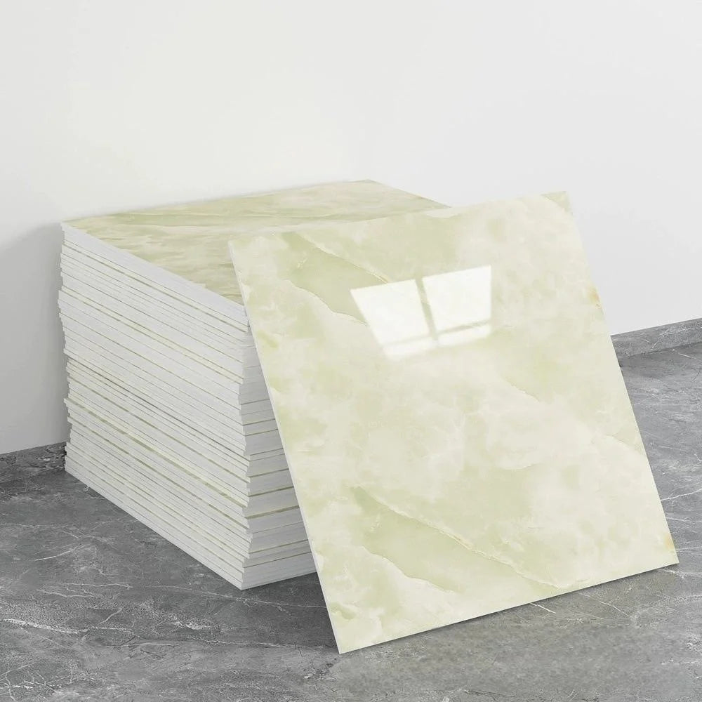 A stack of ten self-adhesive marble tile stickers in a pale yellow and white marbled pattern.