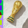 Gold FIFA 2026 World Cup Trophy fridge magnet with a green band.