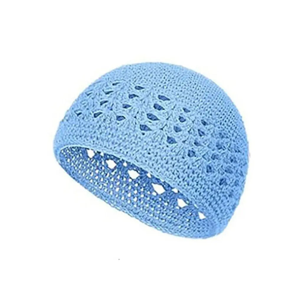 Light blue handmade crochet beanie hat with an openwork pattern