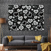 A dark backdrop covered with sparkling white heart shapes for a Valentine's Day photo display.