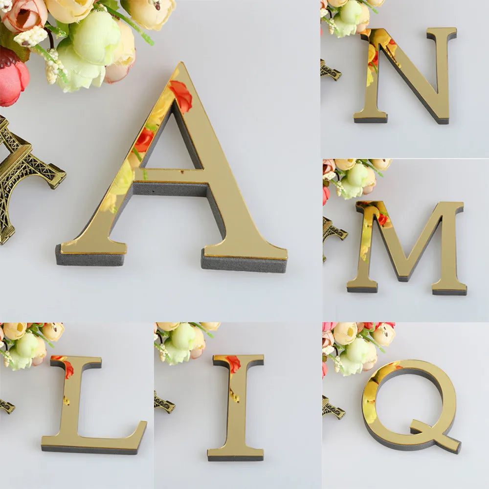 A set of 3D golden letter mirror wall decals including A, N, M, L, I, and Q.