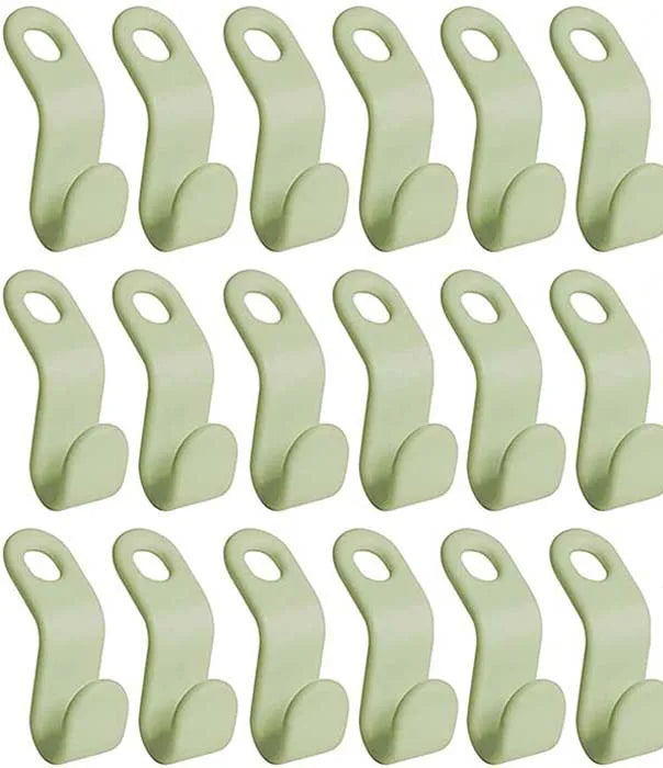 A set of light green space-saving cascading hanger connector hooks for wardrobe organization.