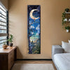 A vertical tapestry wall hanging featuring a crescent moon, blue and green foliage, and floral elements against a dark backgr
