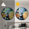 A minimalist round wall clock showing a time, with a crescent moon and sun graphic above it.