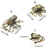 Three views of an antique brass octopus desk ornament showing its size and detail.