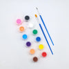 A set of paintable craft masks and a fine paintbrush laid out on a white surface.