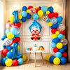A colorful balloon arch garland featuring blue, yellow, and red balloons shaped like a cartoon clown for a party decoration.