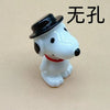 A white dog pendant with a black hat and red collar, used for jewelry making.