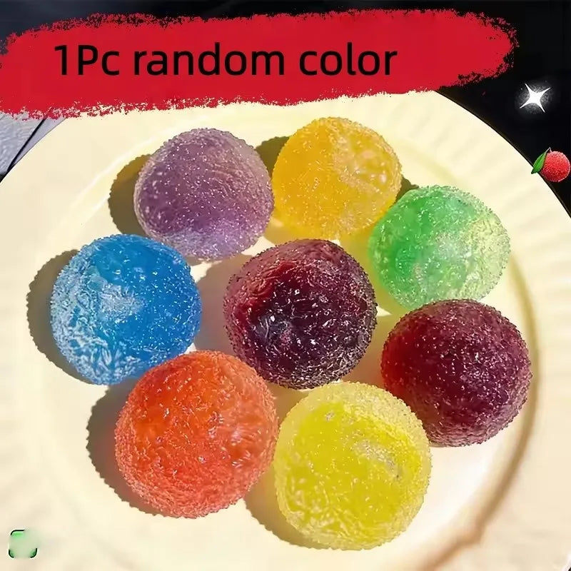 A plate of 8 colorful sensory stress reliever squeeze balls in various shades including purple, yellow, blue, and green.