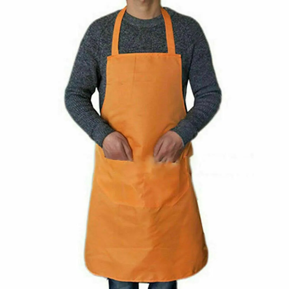 A person wearing a bright orange waterproof kitchen apron over a gray long-sleeved shirt.