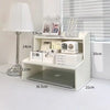 A white two-layer desktop organizer shelf featuring compartments for stationery and small electronics.