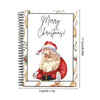 A spiral-bound book featuring a festive illustration of a bearded man in a Santa hat.