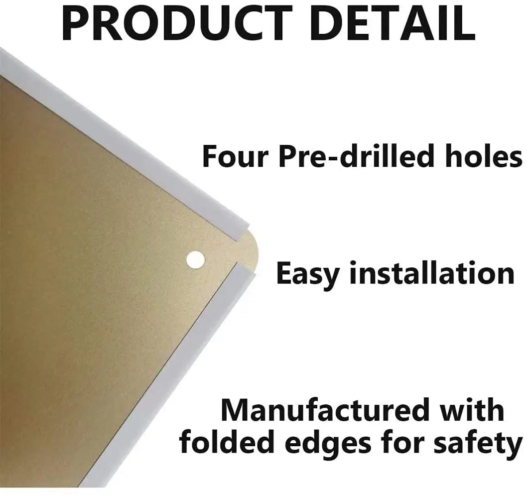 Close-up of a gold metal tin sign with four pre-drilled holes and folded edges for easy installation