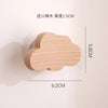 A light wood cloud-shaped hook with a 5.8cm length and 9.2cm width, designed for use in doors.