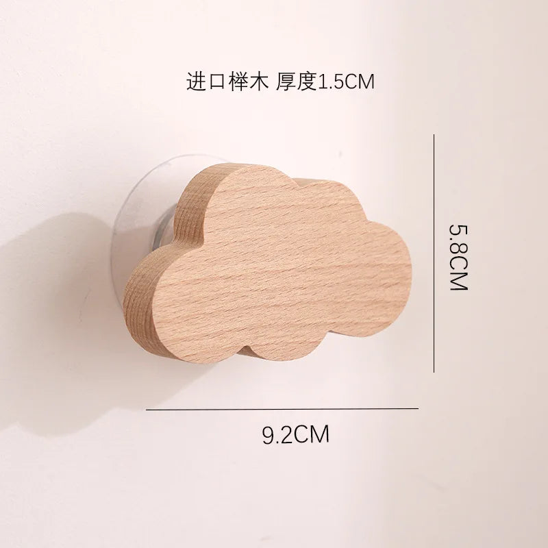 A light wood cloud-shaped hook with a 5.8cm length and 9.2cm width, designed for use in doors.