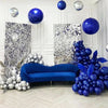 A luxurious interior decorated with blue and silver latex balloons, including large spherical balloons and clusters of round 