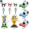 A collection of various soccer-themed decorations including balloons, a trophy, and a pair of soccer-themed shoes.