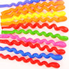 A collection of assorted colorful wavy latex balloons arranged in a row.