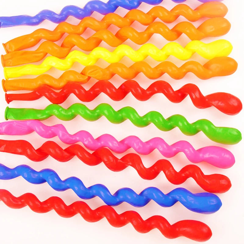 A collection of assorted colorful wavy latex balloons arranged in a row.