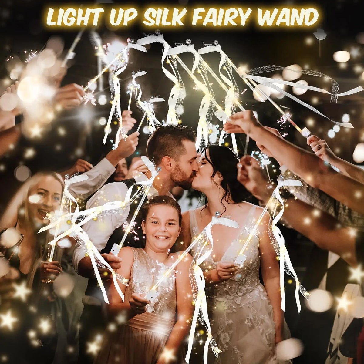 A group of people celebrating with light up silk fairy wands and ribbons at an event.