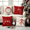 Red Christmas cushion covers featuring a bow, wreath, and snowflake design on white fabric.