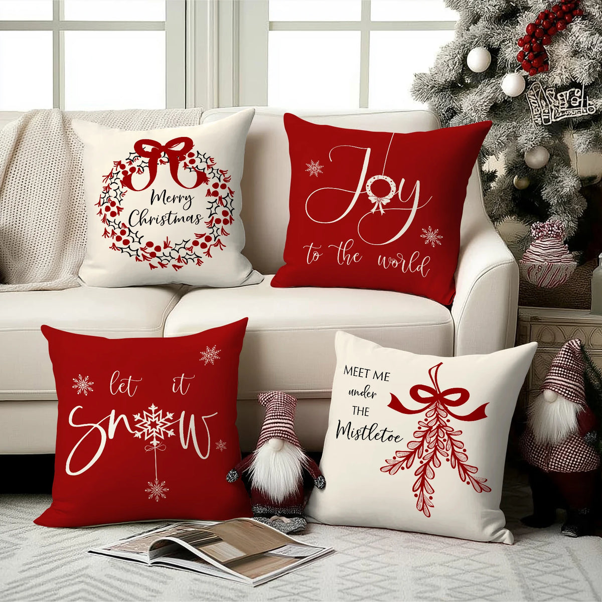 Red Christmas cushion covers featuring a bow, wreath, and snowflake design on white fabric.