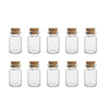 A row of twelve clear glass vials with natural cork stoppers arranged in a single line.