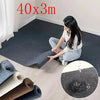 A woman is shown using a self-adhesive solid color runner rug on a light wood floor, with rolled-up rugs nearby.
