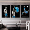 Three framed canvas prints featuring Cristiano Ronaldo celebrating soccer with a blue ball
